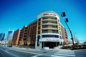 a building on the corner of a city street at Hampton Inn & Suites Nashville-Downtown in Nashville