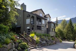 a large house with a landscaping in front of it at Powderview 12 by Whistler Premier in Whistler