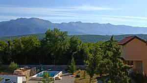 a house with a view of the mountains at Lavender in Budva