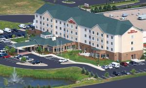 an aerial view of a hotel with a parking lot at Hilton Garden Inn St. Paul Oakdale in Oakdale