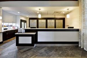 a large kitchen with a large counter in a room at Homewood Suites by Hilton Augusta in Augusta