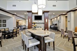 a dining room with a table and chairs at Homewood Suites by Hilton Augusta in Augusta