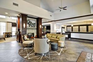 a living room with a couch and a table at Homewood Suites by Hilton Augusta in Augusta +28 photos