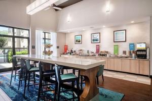 a large kitchen with a large table and chairs at Hampton Inn & Suites Nashville Franklin in Franklin