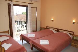 Postel nebo postele na pokoji v ubytování Hotel Sevilli