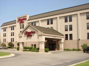 a hotel building with a parking lot in front of it at Hampton Inn East Lansing in East Lansing