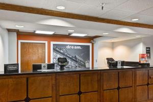 a check in counter with a sign that says dream at Hampton Inn Memphis Poplar in Memphis