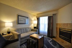 a living room with a couch and a fireplace at Homewood Suites by Hilton Phoenix-Biltmore in Phoenix