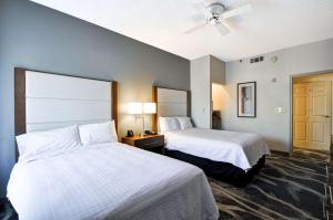 a hotel room with two beds and a ceiling fan at Homewood Suites by Hilton Phoenix-Biltmore in Phoenix