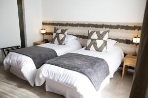 Ένα ή περισσότερα κρεβάτια σε δωμάτιο στο O2 Hotel Iguazu