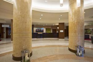 a lobby with two large columns in a building at Hilton Garden Inn Baltimore Inner Harbor in Baltimore