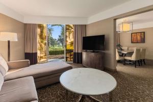 a living room with a couch and a table at Hilton La Jolla Torrey Pines in San Diego