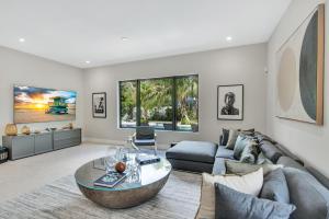 a living room with a couch and a table at Villa in Coral Gables with Pool Jacuzzi Game Room in Miami