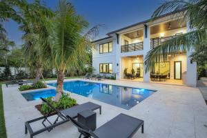 an exterior view of a house with a swimming pool at Villa in Coral Gables with Pool Jacuzzi Game Room in Miami