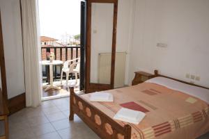 Postel nebo postele na pokoji v ubytování Hotel Sevilli
