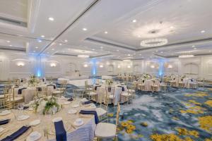 a banquet hall with white tables and chairs at Hilton Irvine/Orange County Airport in Irvine +32 photos