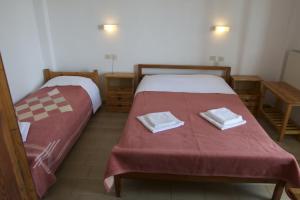 Postel nebo postele na pokoji v ubytování Hotel Sevilli