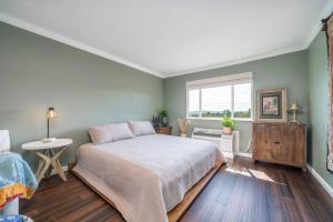 a bedroom with a bed and a window at The Olive Tree Loft in Hot Springs
