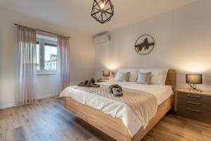 a bedroom with a large bed and a window at Villa Antique in Novi Vinodolski +68 photos