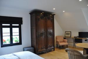 Sjónvarps- og/eða afþreyingartæki á Guesthouse Villa Vauban