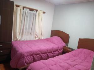 Ein Bett oder Betten in einem Zimmer der Unterkunft Casa frente al mar