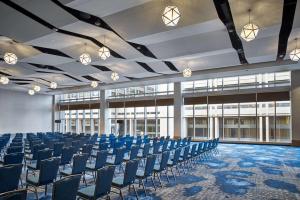 a large room with blue chairs in a building at Hilton Cleveland Downtown in Cleveland +62 photos