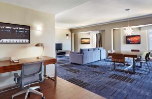 a living room with a couch and a table at Hilton Newark Airport in Elizabeth