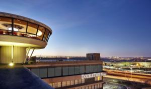 a building with a view of a city at night at DoubleTree by Hilton Washington DC – Crystal City in Arlington