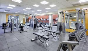 a gym with rows of treadmills and machines at DoubleTree by Hilton Washington DC – Crystal City in Arlington