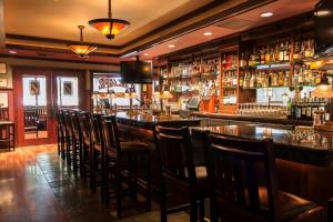 a bar with a lot of chairs in a room at DoubleTree by Hilton Spokane City Center in Spokane
