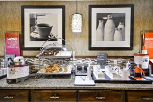 a counter with some food and drinks on it at Hampton Inn Bozeman in Bozeman