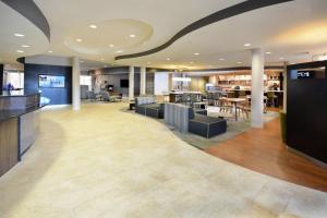 a hotel lobby with a bar and a restaurant at Courtyard Danville in Danville