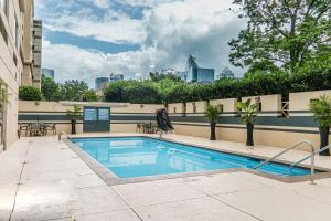 a swimming pool on top of a building at Doubletree by Hilton Charlotte Uptown in Charlotte