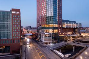 a city with tall buildings and a street with cars at Hilton Columbus Downtown in Columbus