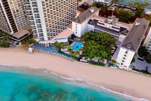 an aerial view of the beach at the resort at Moana Surfrider, A Westin Resort & Spa, Waikiki Beach in Honolulu