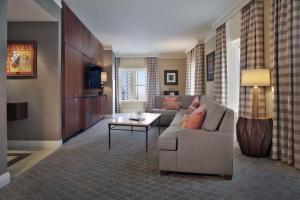 a living room with a couch and a table at The Skirvin Hilton Oklahoma City in Oklahoma City