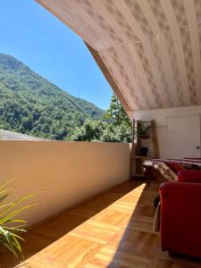 a living room with a view of a mountain at Guest House Lulu in Barisakho