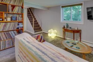 a living room with a couch and a table at Pet-Friendly Staatsburg Studio - Near State Park 