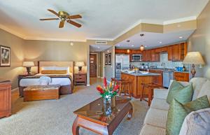 a hotel room with a bed and a living room at HK #537 in Lahaina