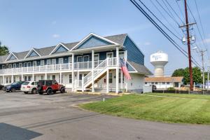 a large white building with a water tower at Rehoboth Beach Vacation Rental with Community Pool! in Rehoboth Beach