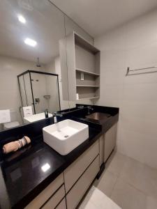Ванная комната в Estúdio Moderno e Elegante no Vertigo