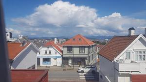 a view of a city with houses and a car at Large House in Central Stavanger in Stavanger