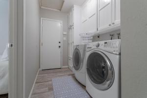 a white laundry room with a washing machine in it at Home Vest in Lancaster
