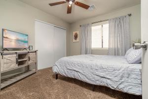 a bedroom with a bed and a ceiling fan at Home Vest in Lancaster