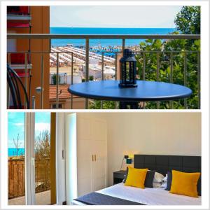 a bedroom and a balcony with a bed and a table at APPARTAMENTI LEONE - Vista Mare in Rimini