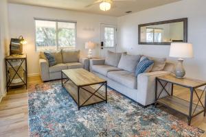 a living room with a couch and a table at Renovated Crescent Lake Escape with Waterfront Deck! in Crescent City