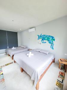 Maui Hostels Tulum客房内的一张或多张床位