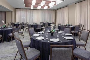 a conference room with tables and chairs and tablesktop at Courtyard Memphis Downtown in Memphis