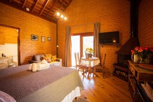 Cama ou camas em um quarto em Chalés Alto dos Pires