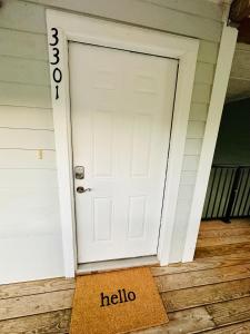 a door with a hello sign in front of it at Rustic ridge 01 in Gatlinburg